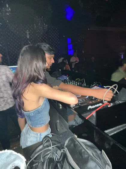 Another candid from a busy night, showing the close quarters of the DJ booth and the gear I work with.