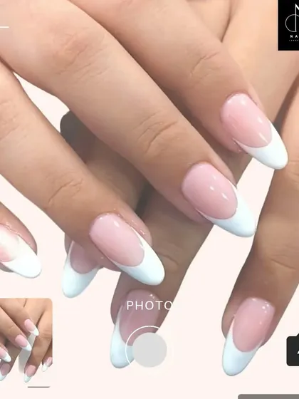A beautifully executed classic French manicure on long, almond-shaped nails. This look is eternally stylish and perfect for any occasion.