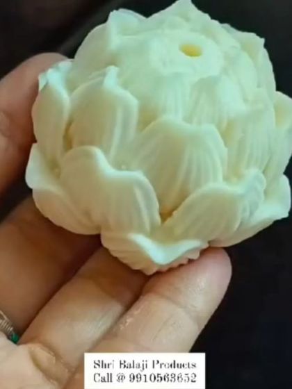 A finished lotus candle made from my silicone mold. The detail in the petals is exquisite, creating a very serene and beautiful final product.