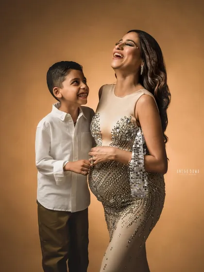 The pure, uninhibited joy of family. This candid moment of laughter between a mother and her son is what my sessions are all about. It’s about capturing the real, beautiful, and sometimes silly love that fills the room.