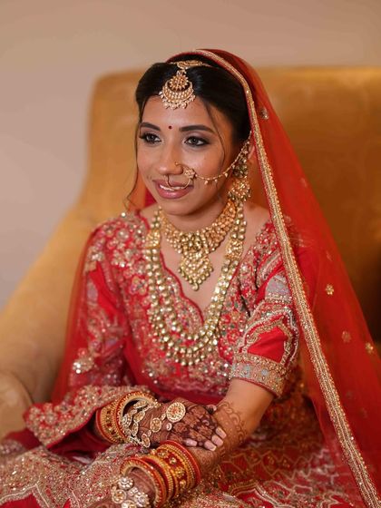 A close up on her beautiful smile and the intricate jewelry that we complemented with a classic makeup look.