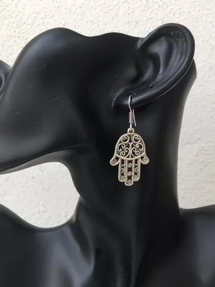 The Hamsa hand is a symbol of protection, and I've made it into this beautiful drop earring. It's a meaningful and stylish piece, available in both silver and antique gold tones.