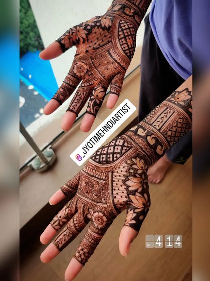 A full-coverage design for the back of the hands, featuring lotus motifs and geometric patterns. This is a great choice for a wedding guest who wants an intricate look.
