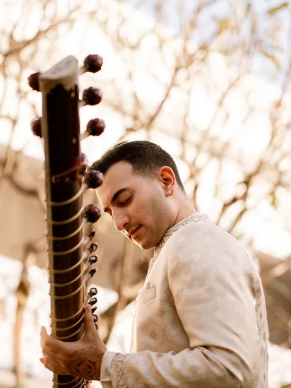 A close-up profile shot in the same cream outfit, with the focus on the connection between me and my instrument.