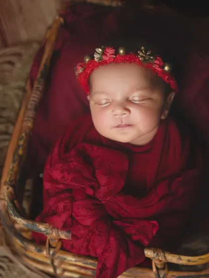 This shot captures the soft light falling on the baby's face, emphasizing their peaceful sleep.