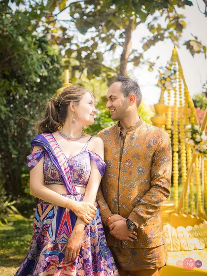 A classic couple portrait from Nelya and Tirath's Haldi. Their coordinated outfits and happy smiles make this a cherished memory.