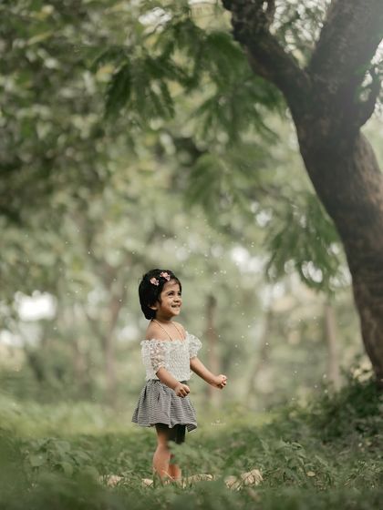 A beautiful, candid shot of her enjoying the magical atmosphere of the woods.