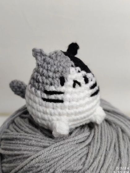 My collection of chubby cat keychains. These little guys come with different colored patches on their heads, including yellow, green, pink, blue, and grey.