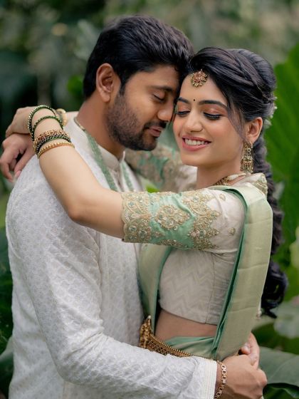 An intimate moment between the bride and groom. The bride's makeup looks flawless and romantic up close.
