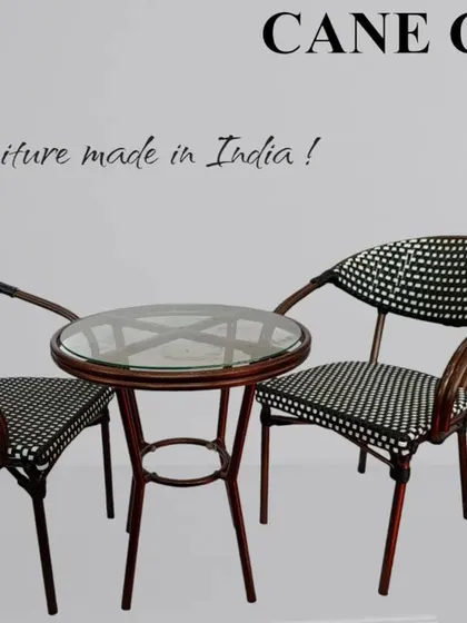 I also specialize in outdoor furniture, like this two-chair and table set. This particular design features a dark, weather-resistant weave and is built to be a durable and stylish addition to any balcony, garden, or cafe patio.