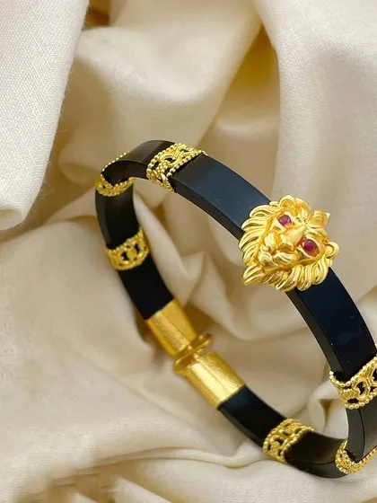 My collection also includes premium accessories for men, like this bold 92.5 silver kada with gold plating. The centerpiece is a powerful, intricately detailed lion head with ruby-red eyes, blending strength with elegance.