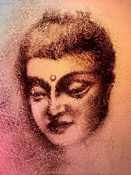 A moment of peace captured in sand. This portrait of Buddha was created for Buddha Purnima, using a blend of colors to evoke a sense of calm and spiritual tranquility.