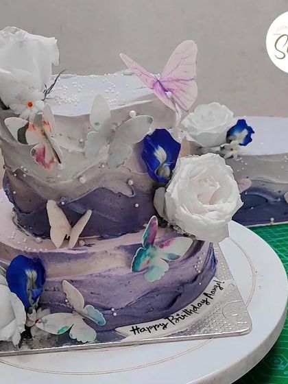 A behind-the-scenes look at the two-tier butterfly cake alongside its smaller matching counterpart. It's always fun to create a set for a big celebration.