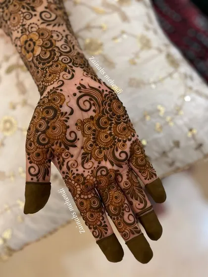 The palm side of one of my favorite designs, showcasing the intricate swirls and details.