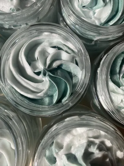 A top-down view of the beautiful swirl in our Green Apple whipped bath crème.