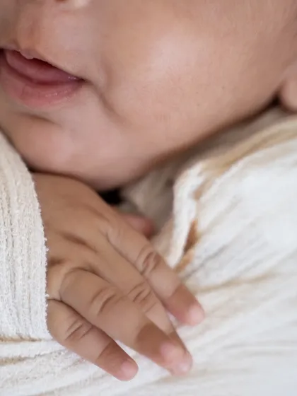 A macro shot of a baby's tiny fingers and soft lips. These are the details you will want to zoom in on and admire for years to come.