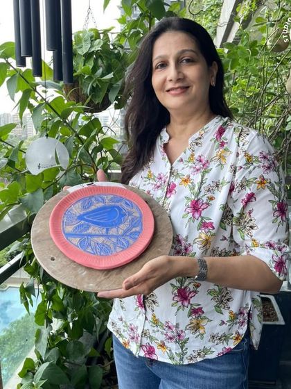 A beautiful bird and branch design carved into a pink and blue plate. Sgraffito allows for such wonderful creativity.