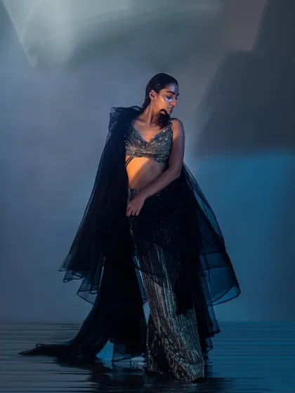 This look, titled "The Sea of Life," features a glass-skin makeup finish and a wet, slicked-back hairstyle. The goal was to create an ethereal, almost aquatic feel that complements the flowing, translucent garments.