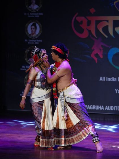 An expressive moment from the Kuchipudi duet performance, showcasing the chemistry and storytelling between the two artists.
