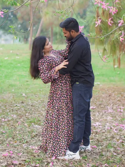 Another angle of a candid, dancing moment, showing the fun and playful side of the couple's relationship during their pre-wedding photo session.