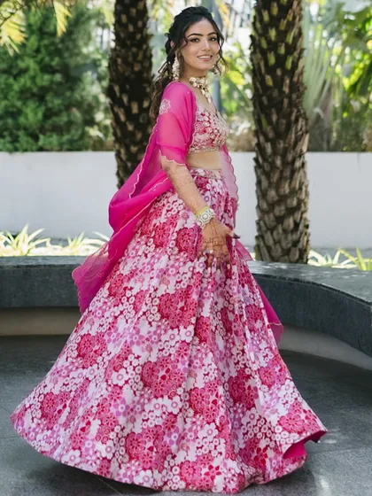 The full-length view shows how the playful hairstyle complements the twirl-worthy floral lehenga for a perfect Haldi look.