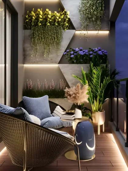 We designed this balcony for evening relaxation, using strategic lighting to create a warm and inviting atmosphere. Backlit geometric wall panels double as planters, while subtle floor lighting highlights the wooden deck. This setup shows how thoughtful lighting design can completely transform your outdoor space after sunset.