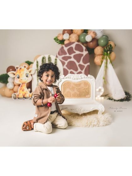 A playful moment during a safari-themed second birthday shoot. I love capturing these candid, in-between moments full of personality.
