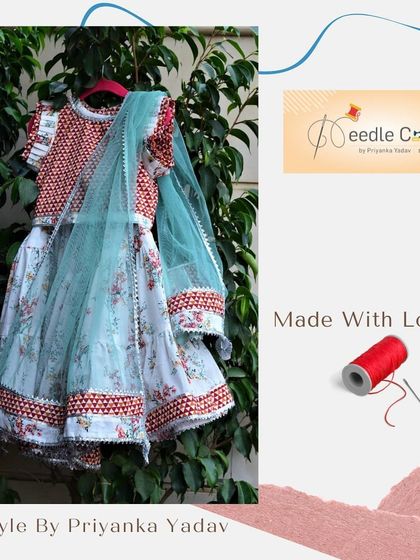 A beautiful floral lehenga choli set with a contrasting red printed choli. The light blue dupatta adds a soft touch, making this a perfectly balanced and adorable ethnic outfit for a little girl.