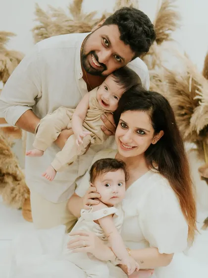 This is what pure happiness looks like. I arranged this family of four, including their adorable twins, in my Faridabad studio against a boho-chic pampas grass setup to create a warm, loving, and perfectly balanced family portrait.