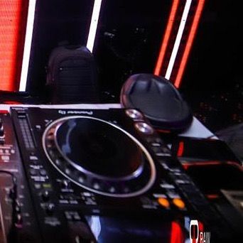 My headphones resting on the decks, waiting for the next track. A classic DJ shot.