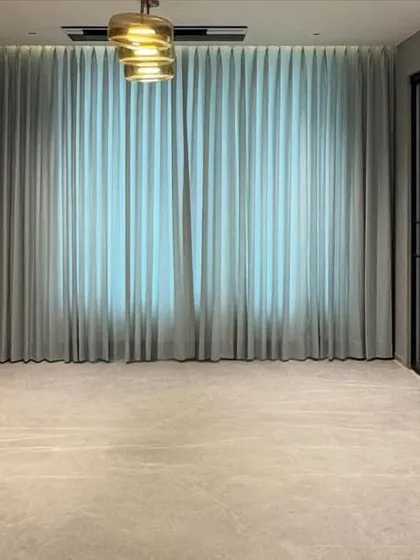 A wide shot of a custom storage unit in a penthouse project. The design includes both closed cabinets for storage and open sections with a marble backsplash, blending functionality with high-end finishes.