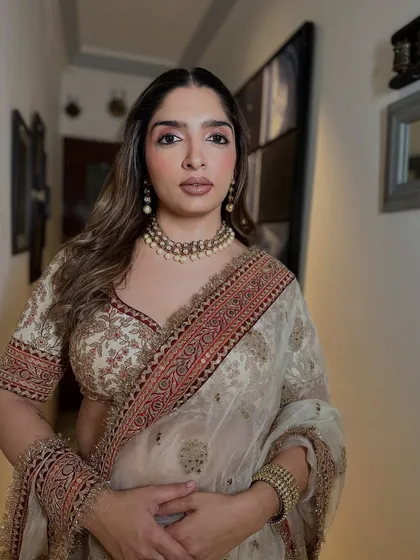 A confident portrait of the guest, ready for the celebration. The makeup is elegant and understated, proving that soft glam can make a powerful statement.