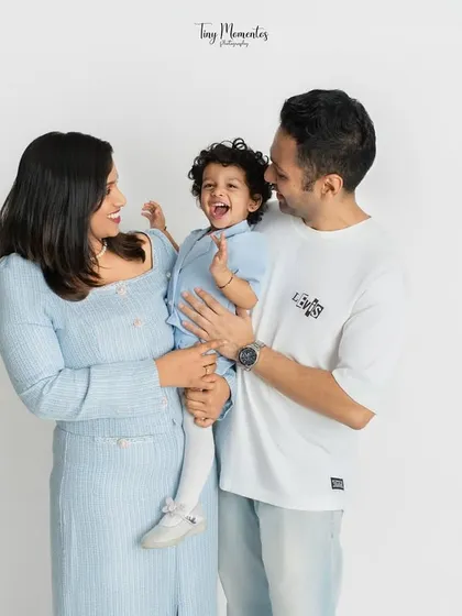 There is nothing more precious than a shared laugh. In my clean and simple studio space, your family's connection becomes the main focus, allowing for authentic moments like this to shine.