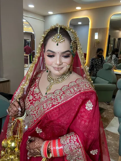 A serene shot of the bride with her eyes closed, showcasing the blended eyeshadow and flawless base.