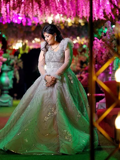A stunning solo portrait of the bride-to-be in her magnificent gown, surrounded by beautiful, soft lighting at her engagement party.