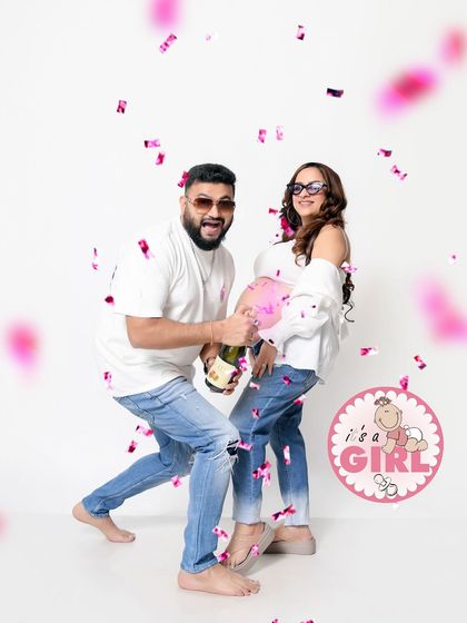 A celebratory gender reveal moment. We capture the excitement with a pop of pink confetti, announcing "It's a Girl!" in a fun and dynamic way.