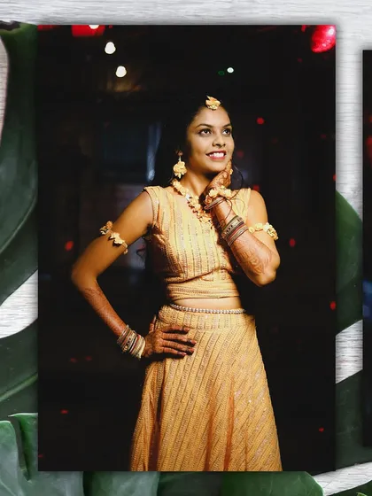 A beautiful portrait of the bride in her yellow Haldi outfit. She strikes a pose, looking radiant and happy before the festivities begin.