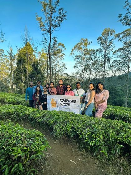 Our group posing in a tea garden in Kodaikanal. The vibrant green of the tea leaves makes for a stunning photo.