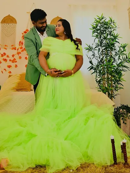 A stunning wide shot of our lime green ruffled gown, filling the frame with vibrant color. This photo, taken in our boho bedroom setup, shows the dramatic effect our gowns can have.