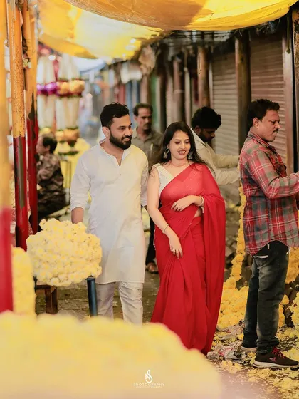 A shot from within the market, using the structure of the stalls to frame the couple and create a sense of place.