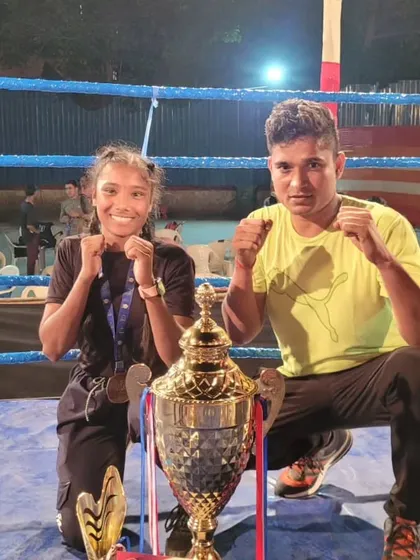 Our champion Pooja Varma with her coach and the trophy from the Krida Mahotsav tournament. We celebrate every victory, big or small.