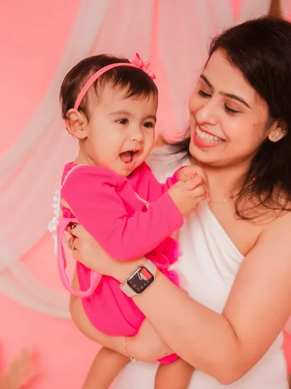 A mother and daughter sharing a happy moment. Her laugh is absolutely precious in this shot.