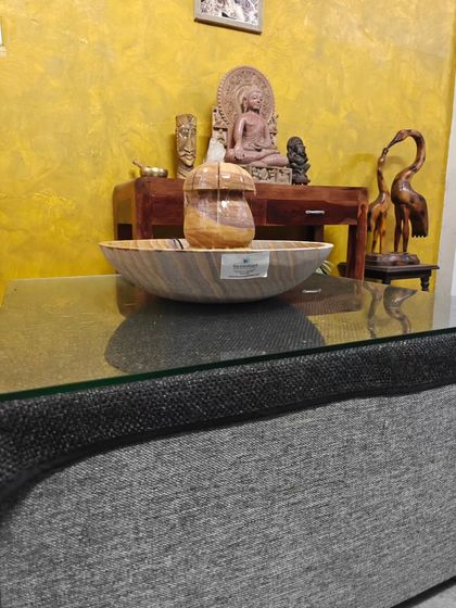 This wide shot shows how a tabletop fountain can be a key decorative element in a living room.