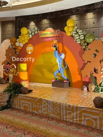 An angled view of the stage, giving a sense of the depth and layers involved in the Lion King decoration.