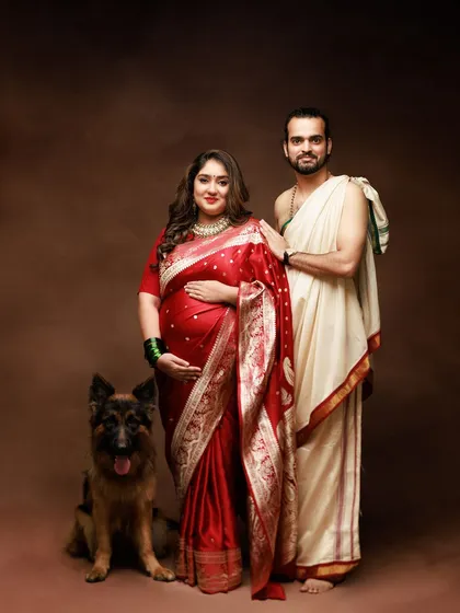 Celebrating family in all its forms. This traditional maternity portrait beautifully includes the family's beloved German Shepherd, because pets are family too.