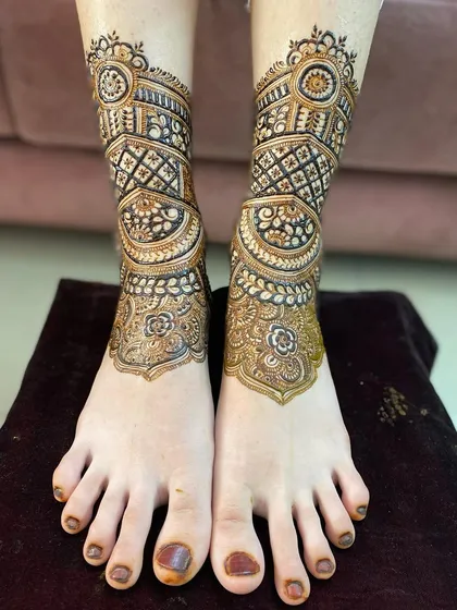 The design is taking shape, with a mix of geometric and floral patterns.