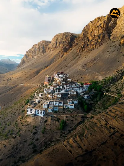 An aerial view of the stunning Key Monastery, perched on a hilltop overlooking the Spiti River. The landscape here is truly out of this world.