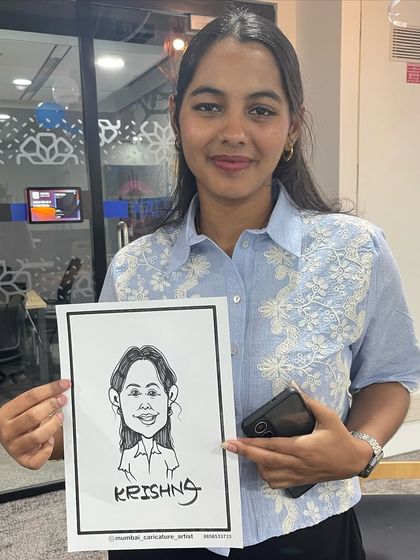 A happy employee holding her caricature at an office event in Mumbai. It's a fantastic way to boost morale and give staff a fun, personal gift.