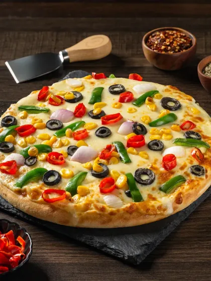 A supreme vegetable pizza loaded with olives, corn, peppers, and onions, a colorful and abundant shot.