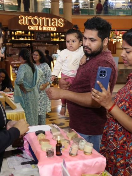 A family checking out the products at my stall in Growel's 101. It's always great to see people's curiosity about natural and handmade skincare.